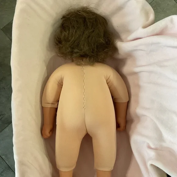 Adorable Baby Doll with Blue Eyes and Pink Outfit - Picture 5 of 7